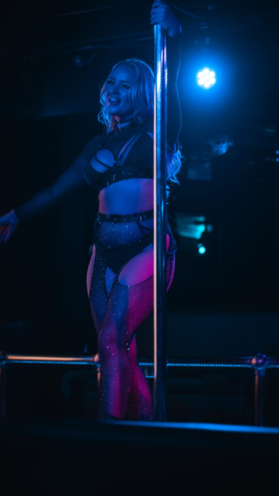 Sapphire dancer using a pole